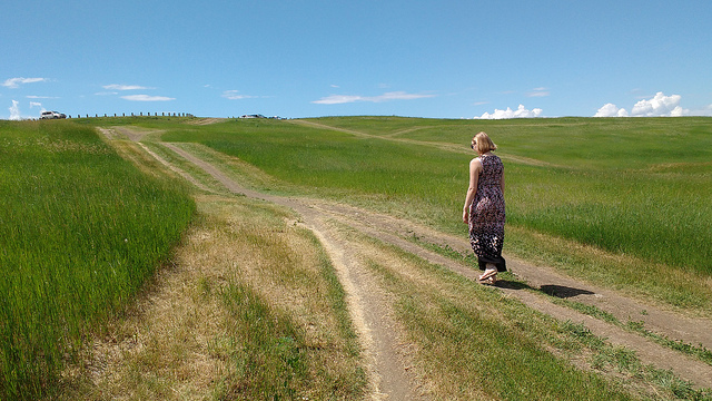 Dorothy walking up a small hill