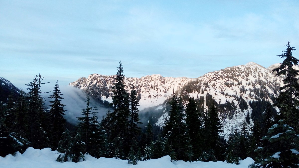 Clouds floating over a distant saddle