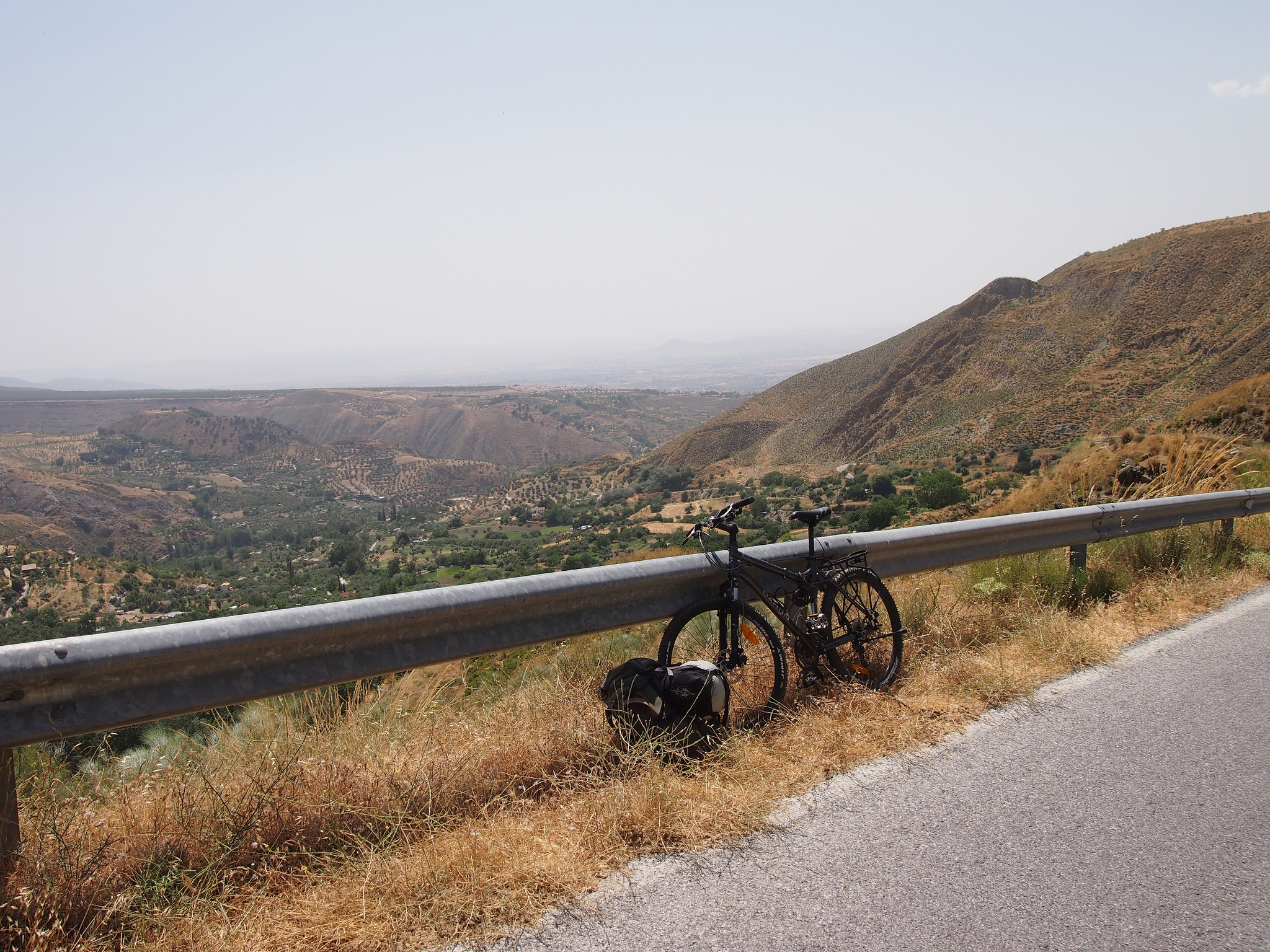 bicycle on the side of the road on a hill