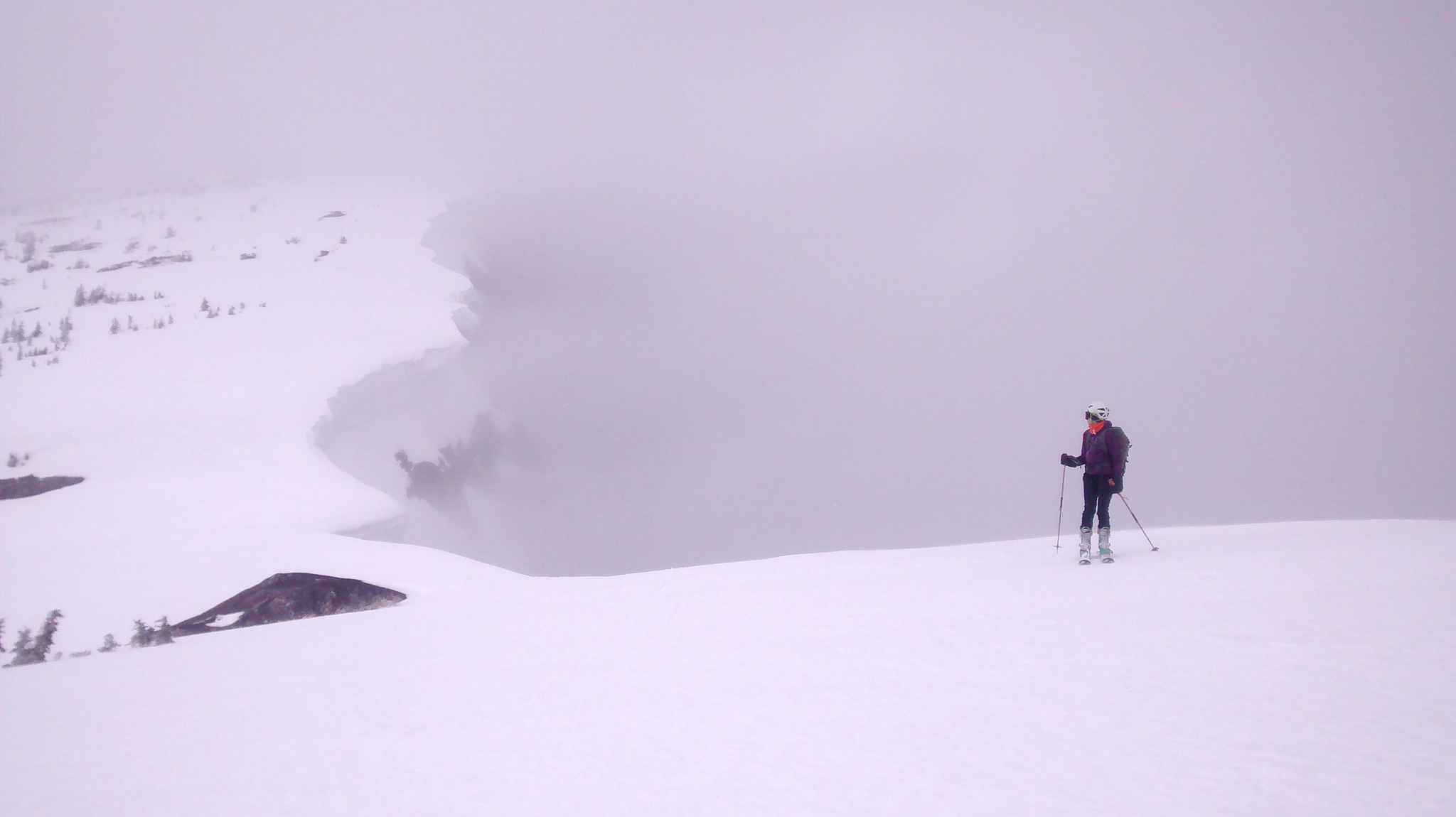 skier looking back on windy ridge