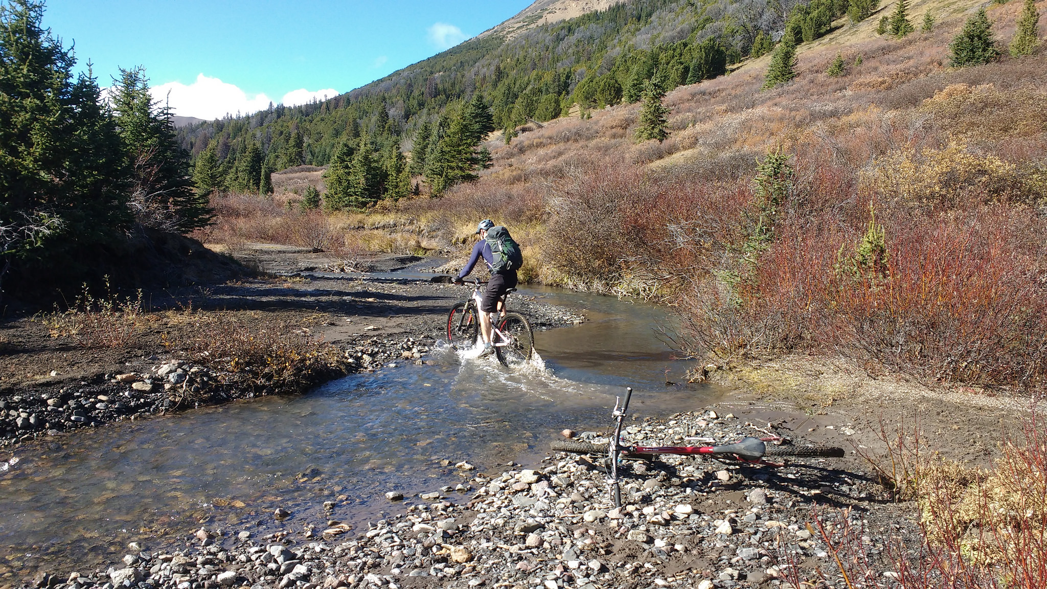 biking through a small creek