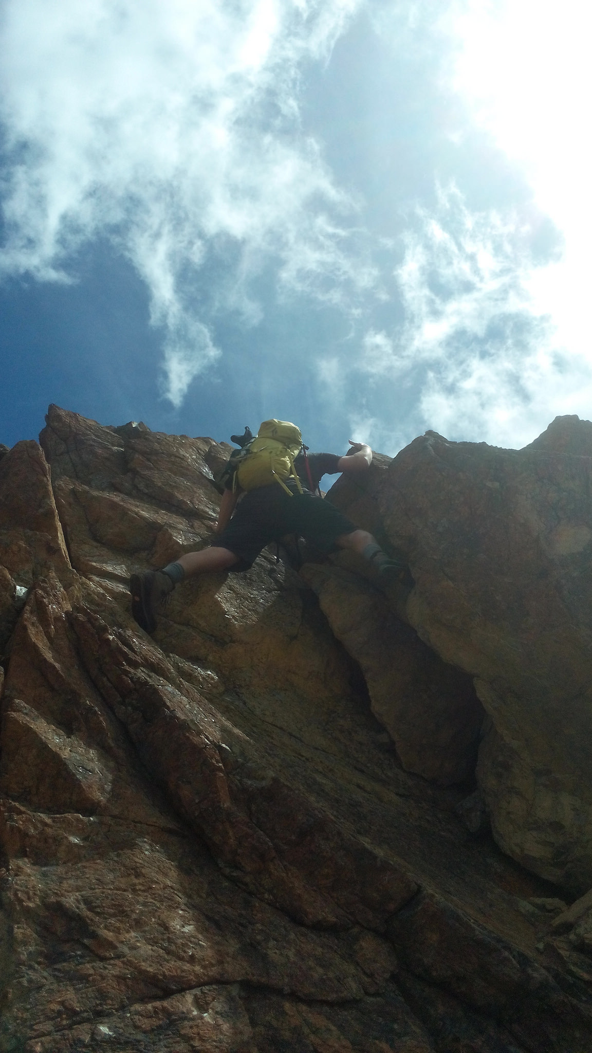 Alan climbing steep-ish rock