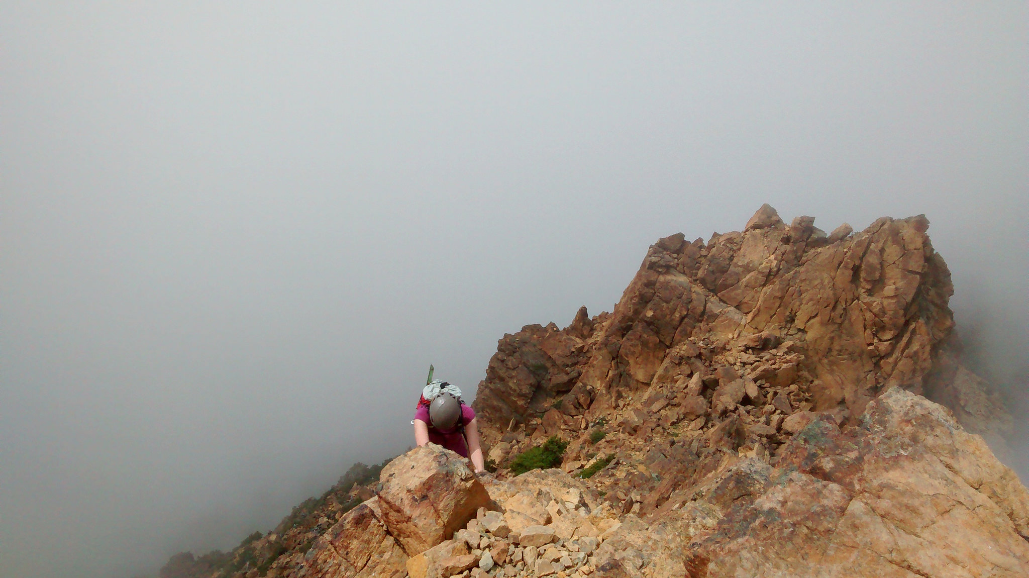 Climbers on a foggy ridge