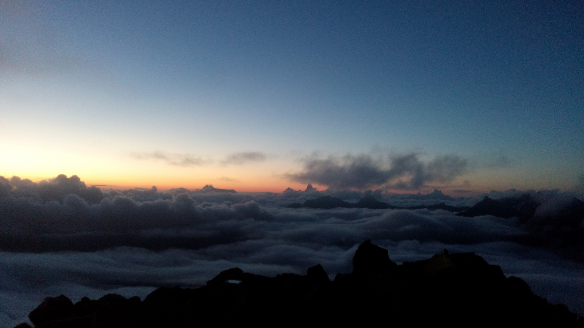 Sun setting on clouds